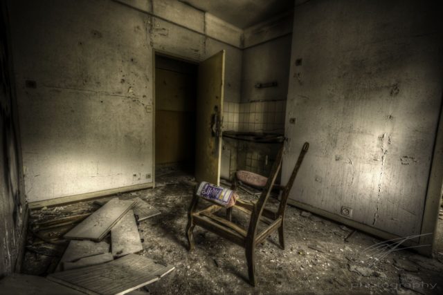 Lonely Chair in the CLinique du Diable, an abandoned sanatorium / hospital / hotel in Alsace, France