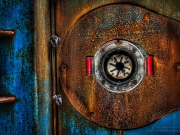 The rusty door of one of the remaining boilers of the Clinique Du Diable.